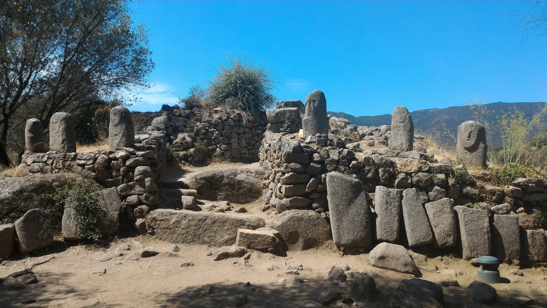 Filitosa: Carved figures and monumental stone structures share the same setting.
